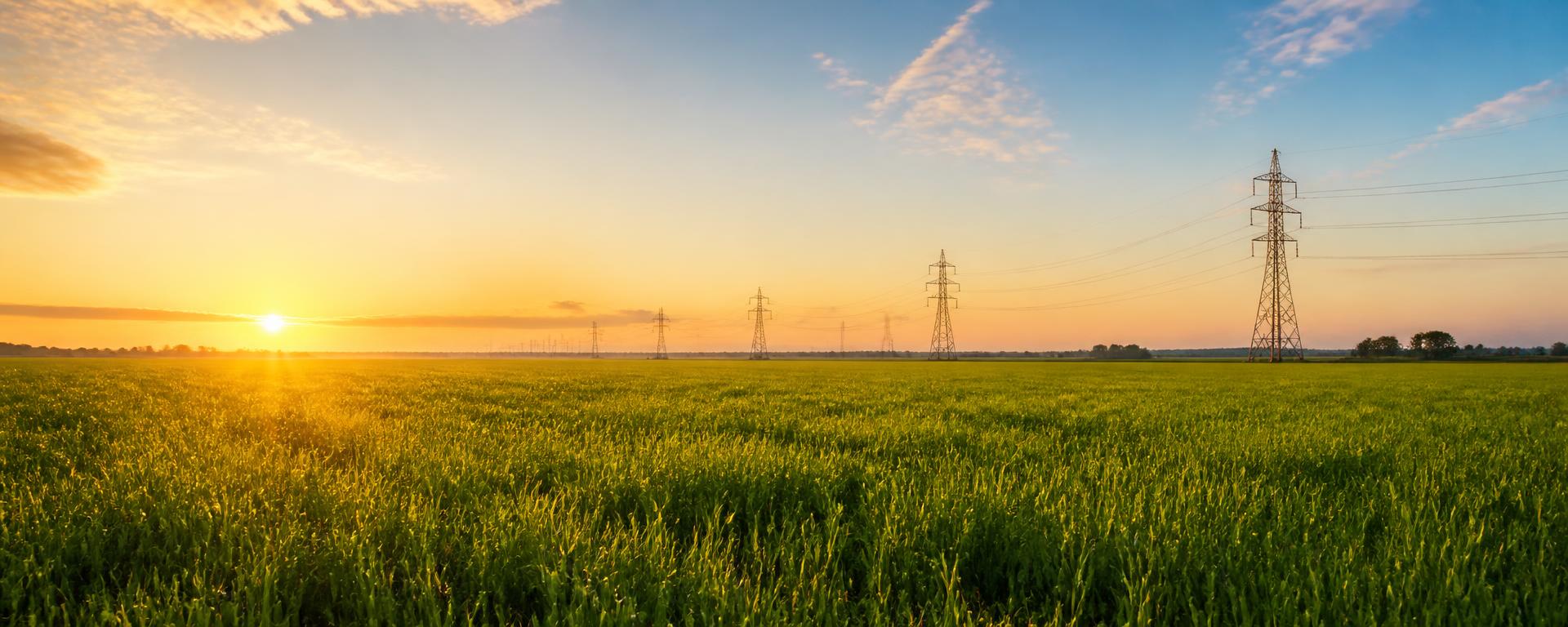 Greenfield development site with transmission lines on the horizon
